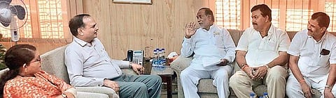 BJP State unit president K Laxman speaks to Chief Secretary SK Joshi during a meeting on Tuesday | Express