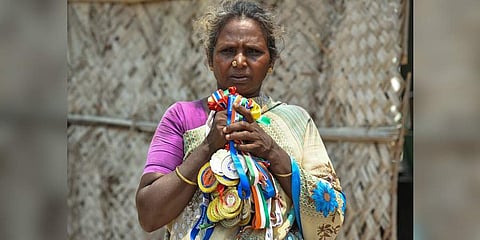 Gomathi’s mother Rasathi displays the athlete’s medals with pride at her residence in Mudikandam. (Photo | MK Ashok Kumar, EPS)