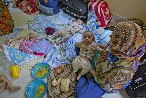 Ahmadi Muslim refugee twin-children with their mother Razia Baby at a community center that they took refuge in Pasyala, north east of Colombo, Sri Lanka (Photo | AP)