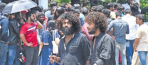 Aspirants wait outside the venue to take part in the auditions of  KGF-Chapter 2, at Malleswaram in Bengaluru on Friday | pushkar V