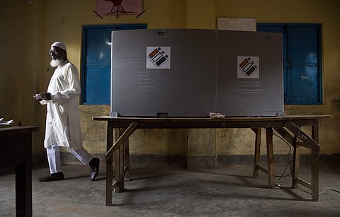A man leaves after casting his vote during the third phase of general election in Gauhati. (Photo | AP)