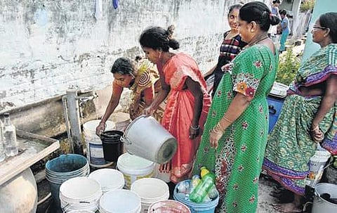 A file photo of women collecting drinking water from a public tap at Krishnalanka in Vijayawada | Express