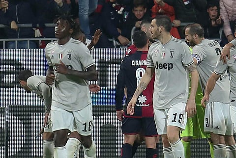 Cagliari fans shout to Juventus's Moise Kean, foreground left, after he scored his side's second goal during a Serie A soccer match between Cagliari and Juventus at the Sardegna Arena Stadium in Cagliari, Italy. (Photo | AP)