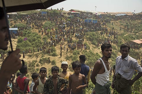 Rohingya refugees watch as firefighters douse flames at the Kutupalong refugee camp in Cox's Bazar in Bangladesh (File photo | AP)