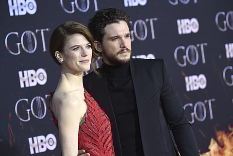 Kit Harrington who plays the character of Jon Snow poses at the red carpet with his wife Rose Leslie for the GOT premiere. While Kit looked dashing in a black suit, his wife and former GOT actress Rose Leslie looked gorgeous in a red dress.  (Photo | AP)