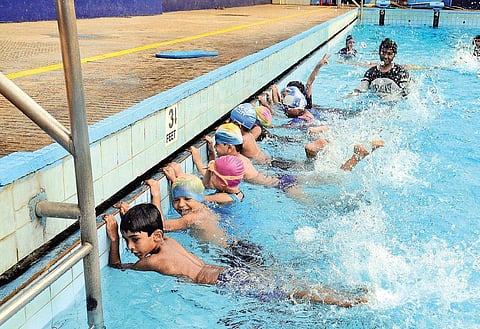 Children training in a swimming pool at a camp (file photo)
