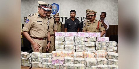 Hyderabad Police Commissioner Anjani Kumar and others pose with `3.30 crore cash seized in Hyderabad. (Photo |  R Satish Babu, EPS)