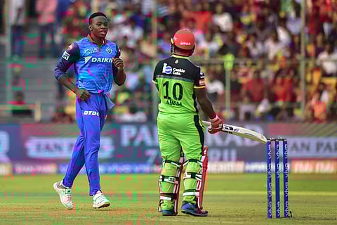 DC bowler Kagiso Rabada reacts after taking the wicket of Royal Challengers Bangalore RCB player Akshdeep Nath. (Photo | PTI)