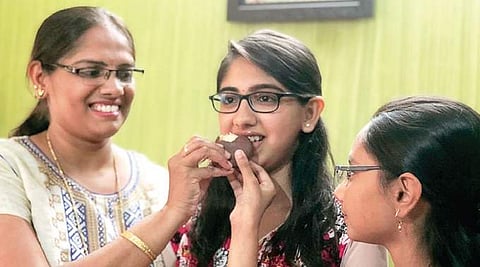 SSLC topper Shambavi celebrates with family at Thyagarajanagar  in Bengaluru on Tuesday  | express