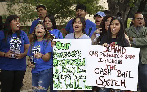 Protesters gather in front of Maricopa County Attorney Bill Montgomery's office Thursday in Phoenix. (Photo | AP)