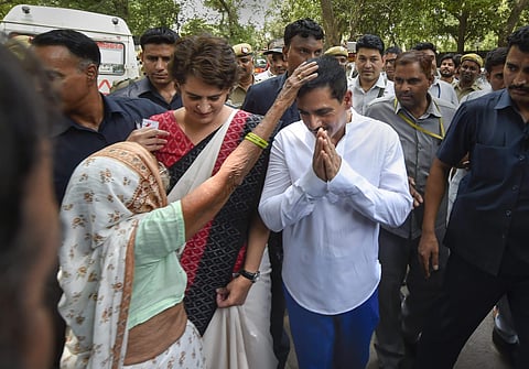 Priyanka Gandhi and Robert Vadra get blessed by an elderly voter after they cast their votes in New Delhi on 12 May 2019 (File Photo | Shekhar Yadav, EPS)