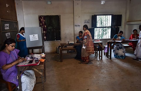 Voters cast their votes at a polling station during the sixth phase of Lok Sabha elections at Ghatal in West Midnapore district of West Bengal Sunday May 12 2019. | PTI
