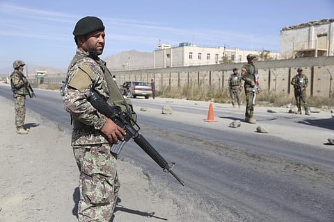 Afghan National Army soldiers stand guard at a checkpoint in Kabul, Afghanistan. | AP