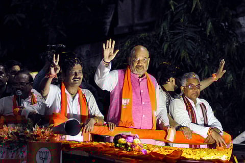 BJP National President Amit Shah during an election roadshow in support of party's north Kolkata seat candidate Rahul Sinha for the last phase of Lok Sabha polls in Kolkata Tuesday May 14 2019. | PTI
