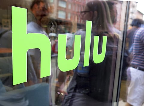 The Hulu logo is seen on a window at the Milk Studios space in New York. Disney has struck a deal with Comcast that gives it full control of streaming service Hulu. (Photo | AP)