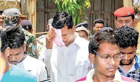 Police take away Father Alphones Aind and other convicts in a gang-rape case after they were awarded life term by a court in Khunti, Jharkhand. ( Photo| PTI)