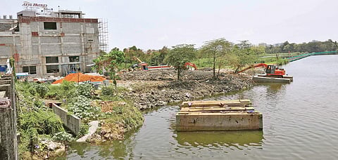 Construction waste is seen dumped into Chilavanoor lake near Elamkulam Metro Station | ARUN ANGELA