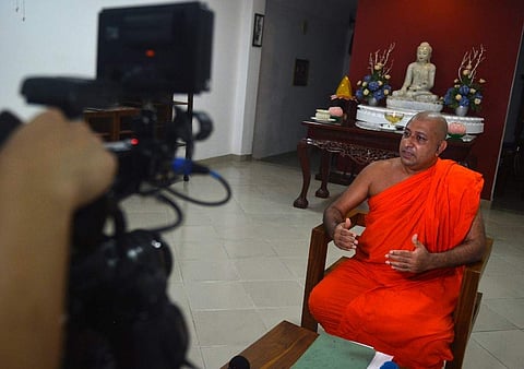 Witharandeniye Nanda, national organiser for Sri Lankan Buddhist nationalist group Bodu Bala Sena (BBS), speaks during an interview with AFP in Colombo on May 2, 2019. Soldiers guarded the gate, but Colombo's landmark Gangaramaya temple was virtually empt