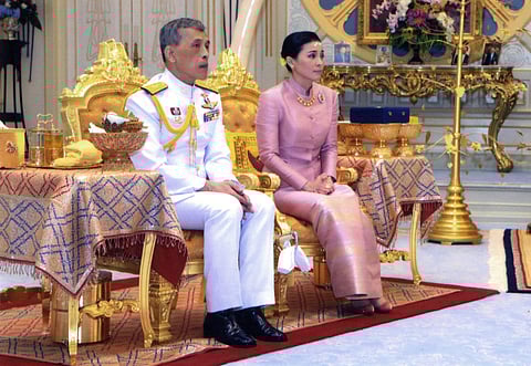 Thailand's King Maha Vajiralongkorn Bodindradebayavarangkun, left, sits with Queen Suthida Vajiralongkorn Na Ayudhya at Ampornsan Throne Hall in Bangkok, Thailand. (Photo | AP)