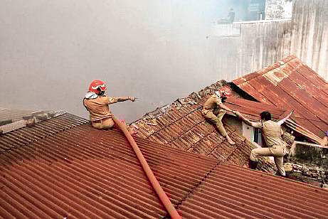 Firefighters dousing the fire at the Chellam Umbrella Mart Nandakumar H V