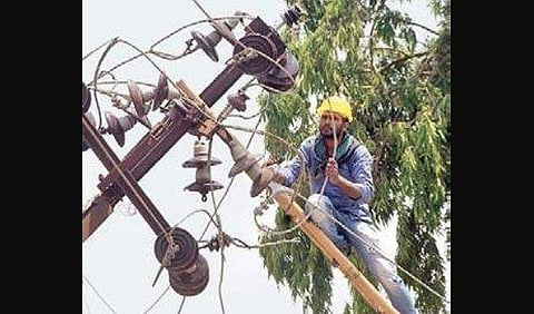 An electrician repairs a pole in Bhubaneswar | biswanath swain