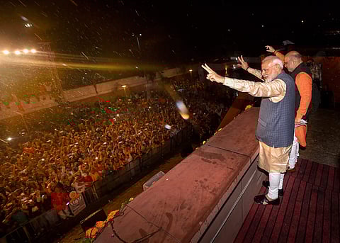 BJP workers welcome Prime Minister Narendra Modi as he along with BJP President Amit Shah arrives at the party headquarters to celebrate the party's victory in the 2019 Lok Sabha elections in New Delhi on 23 May 2019. (Photo | PTI)