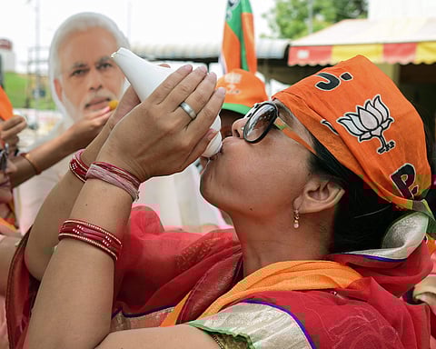 BJP workers celebrate party's lead in the Lok Sabha elections in Bikaner Thursday May 23 2019. | PTI