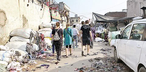 Understanding India Tours will host a Slum Tour at Sanjay Colony on May 26, part of I AM - Identity Art Marathon. (Clockwise) Pictures from their earlier walks in the area.