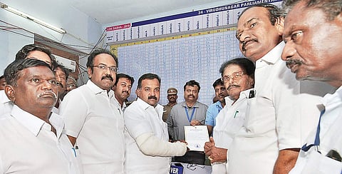 B Manickam Tagore receiving his winning certificate from Returning Officer A Sivagnanam | Express