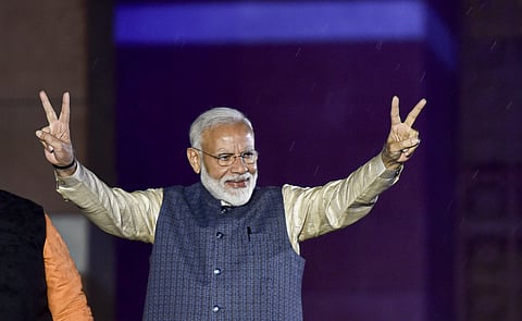 Prime Minister Narendra Modi flashes the victory sign as he arrives at the party headquarters to celebrate the party's victory in the 2019 Lok Sabha elections in New Delhi Thursday May 23 2019. | PTI