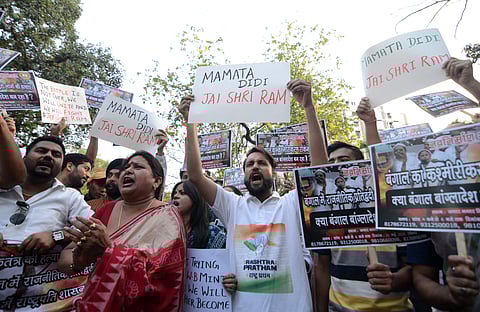 BJP supporters protesting against the murder of 53 BJP workers in West Bengal allegedly by TMC workers for chanting Jai Shri Ram in New Delhi on Sunday.  | (Naveen Kumar P | EPS)