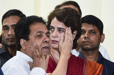 Congress general secretary Priyanka Gandhi and party leader Rajeev Shukla wear dejected looks after their defeat in the Lok Sabha elections on 23 May 2019, at AICC headquarters in New Delhi. (Photo | PTI)