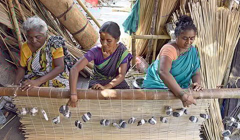 Women weaving bamboo products along Wall Tax Road. (Photo | Martin Louis, EPS)