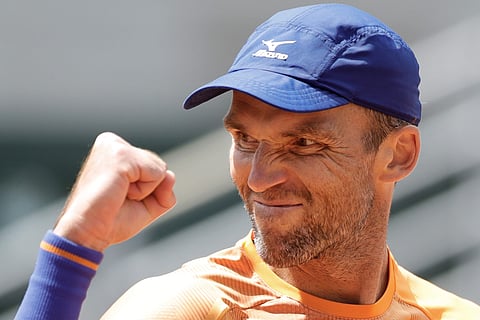 Ivo Karlovic beats Feliciano Lopez in French Open's oldest match-up