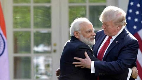 President Donald Trump and Prime Minister Narendra Modi hug in Washington. (Photo | File/AP)