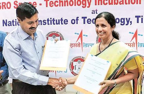 Dr PV Venkatakrishnan, director, Capacity Building Programme Office, ISRO and Dr Mini Shaji Thomas, director NIT Tiruchy exchanging MoUs | Express