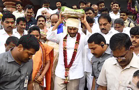 AP CM designate YS Jagan Mohan Reddy presenting silk cloths to the Goddess Kanaka Durga at Indrakeeladri hill in Vijayawada on Wednesday. | Express Photo Services