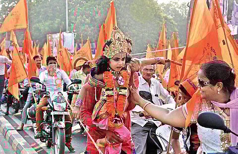 Devotees take out a rally on the occasion of Hanuman Jayanti in the city on Wednesday | P Ravindra Babu