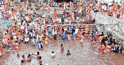 Hanuman devotees take a holy dip in the ‘Dharma Gundam’ at the Kondagattu Anjaneya Swamy Temple in Jagtial district on Wednesday | Express