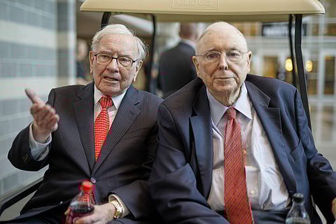 Berkshire Hathaway Chairman and CEO Warren Buffett, left, and Vice Chairman Charlie Munger, briefly chat with reporters Friday one day before Berkshire Hathaway's annual shareholders meeting. (Photo: AP)