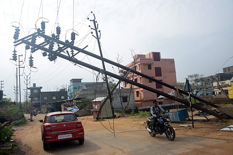 An electric pole damaged by Cyclone Fani near Jharapada in Bhubaneswar (Photo | Biswanath Swain/EPS)