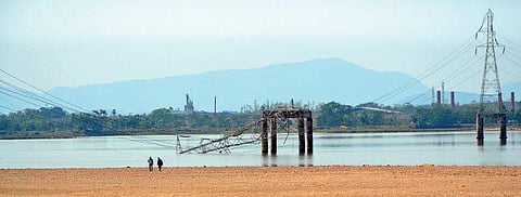An extra high tension line kisses the Mahandi river water at Chahata Ghat in Cuttack | rashmiranjan mohapatra