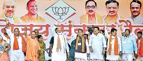 PM Narendra Modi, flanked by UP CM Yogi Adityanath and other BJP leaders, at a rally in Ayodhya