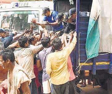 Navy personnel distributing relief material to cyclone-hit people in villages around Puri on Sunday | Express