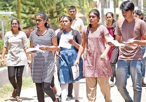 NEET aspirants on their way to a centre (Photo | Nagaraja Gadekal)