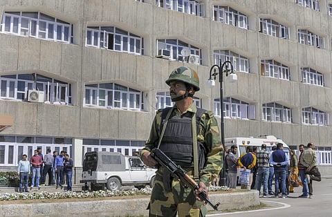 Security personnel stands guard outside Civil Secretariat on the first day of 'Darbar' move shifting of important government offices from Jammu to Srinagar in summer capital Srinagar Monday. (Photo | PTI)