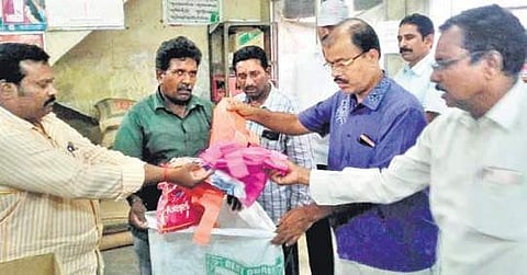 VMC public health department officials seizing plastic below 40 microns during a raid conducted in Vijaywada on Tuesday | Express