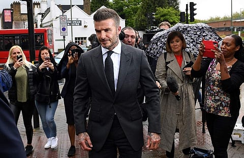 Former England international footballer David Beckham (C) leaves Bromley Magistrates Court in Bromley, south-east of London. (Photo | AFP)