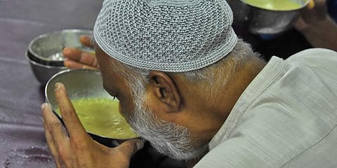 A man breaks his fast by drinking 'kanji'. (Photo | B P Deepu, EPS)