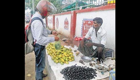 A vendor selling ‘jamun’ at Dhenkanal town.